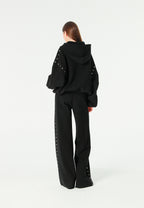 Pantalón palazzo de mujer de pierna ancha con efecto faja y tachuelas laterales | MWM [PS_COLORS:BLACK]