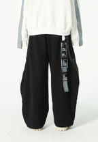 Pantalón barrel con cintas asimétricas MWM y bajos ajustables | MWM [PS_COLORS:BLACK]