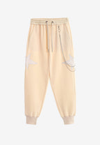 Pantalón jogger Wings con parches de estrellas y cadena lateral | MWM [PS_COLORS:BEIGE]