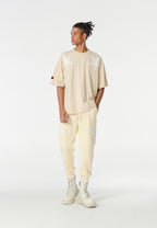 Pantalón jogger Wings con parches de estrellas y cadena lateral | MWM [PS_COLORS:BEIGE]