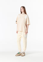 Pantalón jogger Wings con parches de estrellas y cadena lateral | MWM [PS_COLORS:BEIGE]