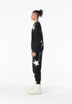 Pantalón jogger Wings con parches de estrellas y cadena lateral | MWM [PS_COLORS:BLACK]