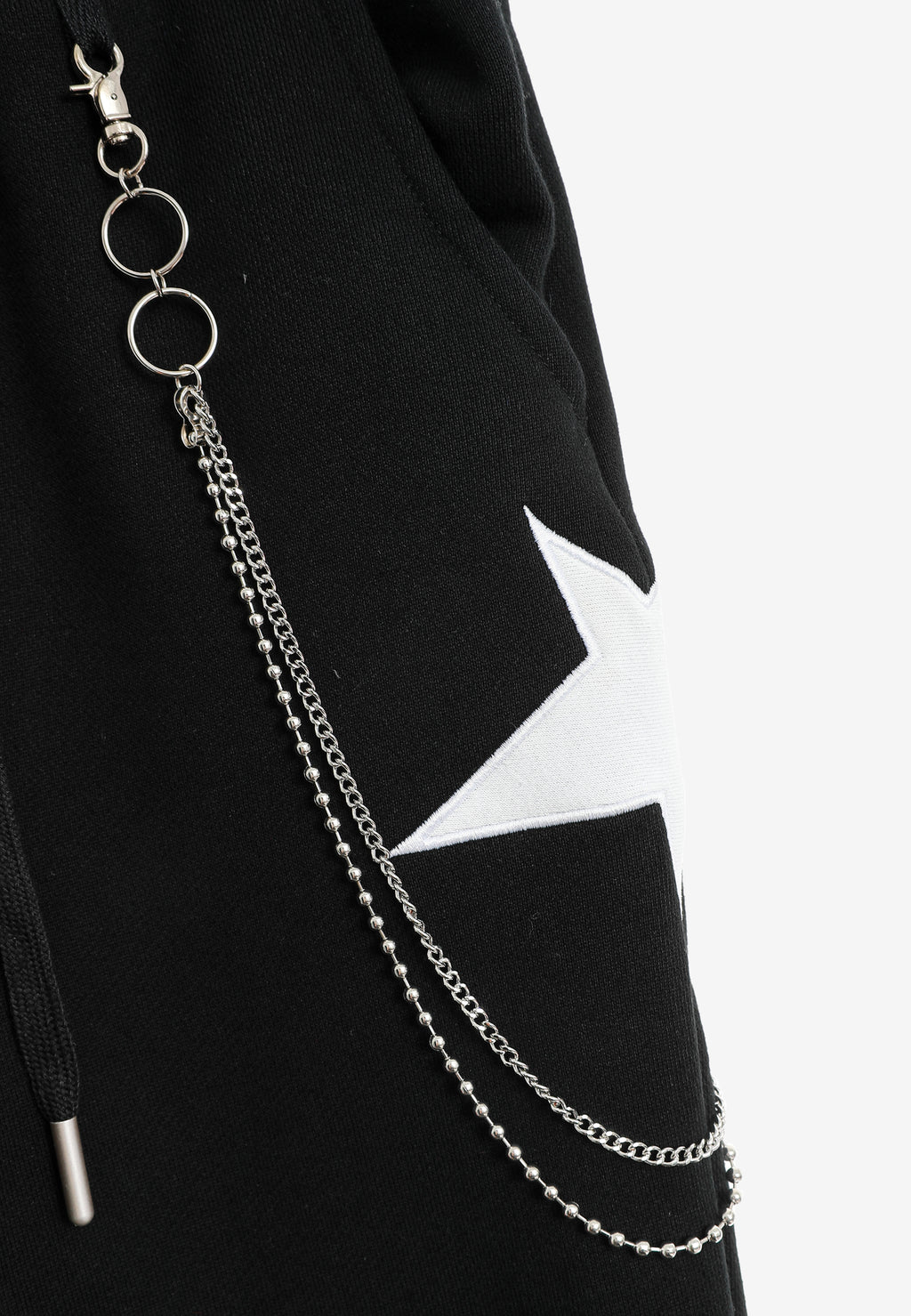 Pantalón jogger Wings con parches de estrellas y cadena lateral | MWM [PS_COLORS:BLACK]