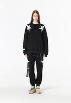 Pantalón jogger Wings con parches de estrellas y cadena lateral | MWM [PS_COLORS:BLACK]