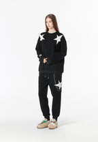Pantalón jogger Wings con parches de estrellas y cadena lateral | MWM [PS_COLORS:BLACK]