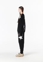 Pantalón jogger Wings con parches de estrellas y cadena lateral | MWM [PS_COLORS:BLACK]