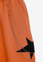 Pantalón jogger Wings con parches de estrellas y cadena lateral | MWM [PS_COLORS:ORANGE]