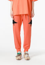 Pantalón jogger Wings con parches de estrellas y cadena lateral | MWM [PS_COLORS:ORANGE]