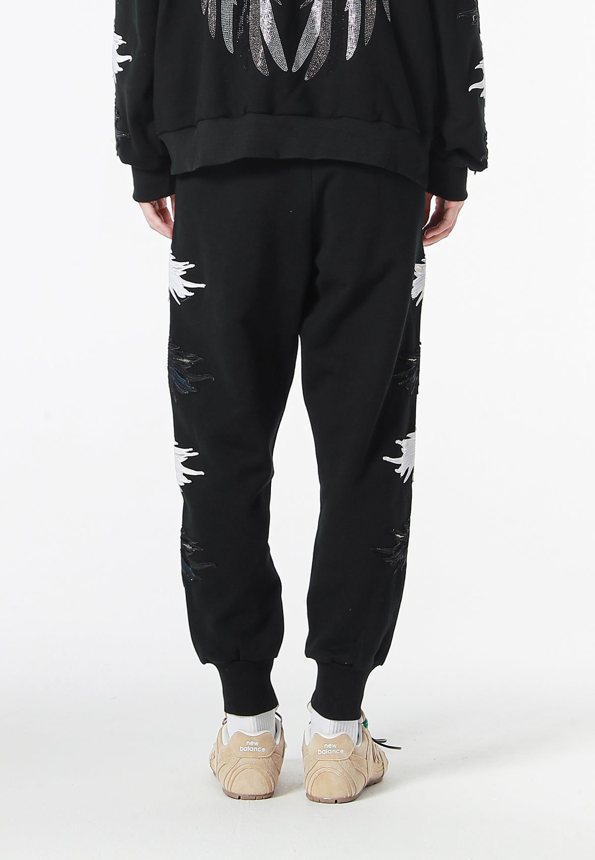 Pantalón jogger Wings con parches Mini Wings en los laterales | MWM [PS_COLORS:BLACK]