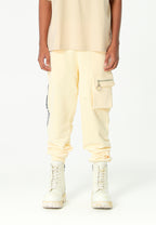 Pantalón jogger Vanguard Dogs con bolsillo cargo lateral y bordado trasero | MWM [PS_COLORS:ECRU]