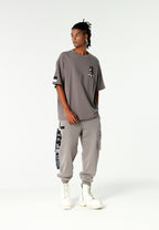 Pantalón jogger Vanguard Dogs con bolsillo cargo lateral y bordado trasero | MWM [PS_COLORS:GREY]