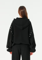 Sudadera con capucha, cremallera frontal, mangas globo y tachuelas metálicas | MWM [PS_COLORS:BLACK]