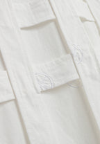 Camisa oversize con diseño entrelazado y motivo circular bordado | MWM [PS_COLORS:WHITE]