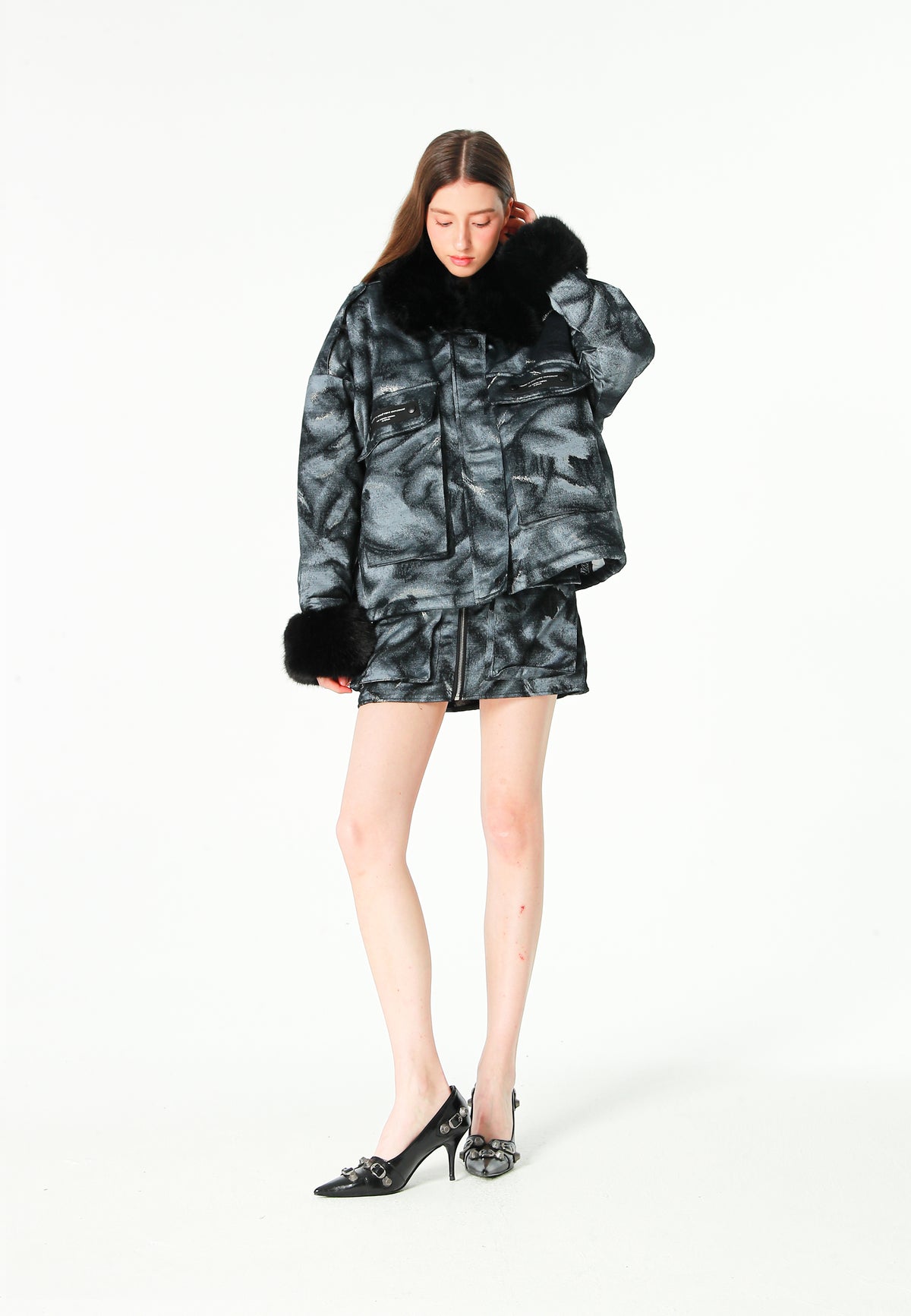 Minifalda jacquard de chenilla con brillo, cremallera y bolsillos frontales | MWM [PS_COLORS:BLACK]