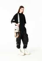 Bolso bandolera con bolsillos y parche con logo | MWM [PS_COLORS:SILVER]