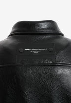 Chaqueta efecto piel con cierre cruzado asimétrico y cuello alto | MWM [PS_COLORS:BLACK]