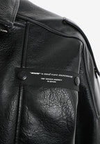 Chaqueta efecto piel con cierre cruzado asimétrico y cuello alto | MWM [PS_COLORS:BLACK]