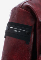 Chaqueta de mujer corta efecto piel con bolsillos en relieve y X de cordones cruzados | MWM [PS_COLORS:BURGUNDY]