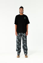 Camiseta de corte regular con motivo Eye MWM bordado en pecho y espalda | MWM [PS_COLORS:BLACK]