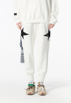 Pantalón jogger Wings con parches de estrellas y cadena lateral | MWM [PS_COLORS:WHITE]
