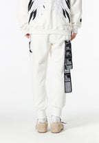Pantalón jogger Wings con parches de estrellas y cadena lateral | MWM [PS_COLORS:WHITE]