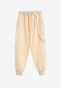 Pantalón jogger de niño Wings con parches de estrellas y cadena lateral | MWM [PS_COLORS:BEIGE]