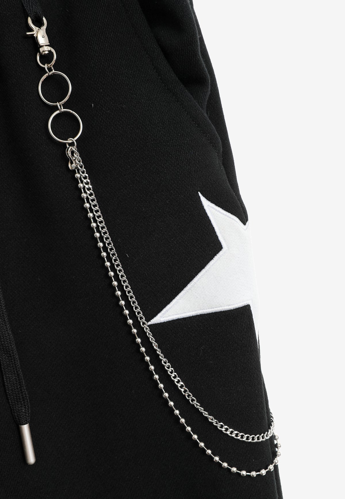 Pantalón jogger de niño Wings con parches de estrellas y cadena lateral | MWM [PS_COLORS:BLACK]
